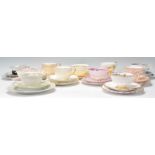 A collection of various vintage 20th Century bone china trio tea cups, saucers and side plates to