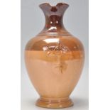 A 19th Century Doulton Lambeth stoneware jug having a lustre glaze with contrasting brown glazes,