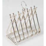 A silver plated toast rack with each section in the form of rowing oars, raised on a rectangular