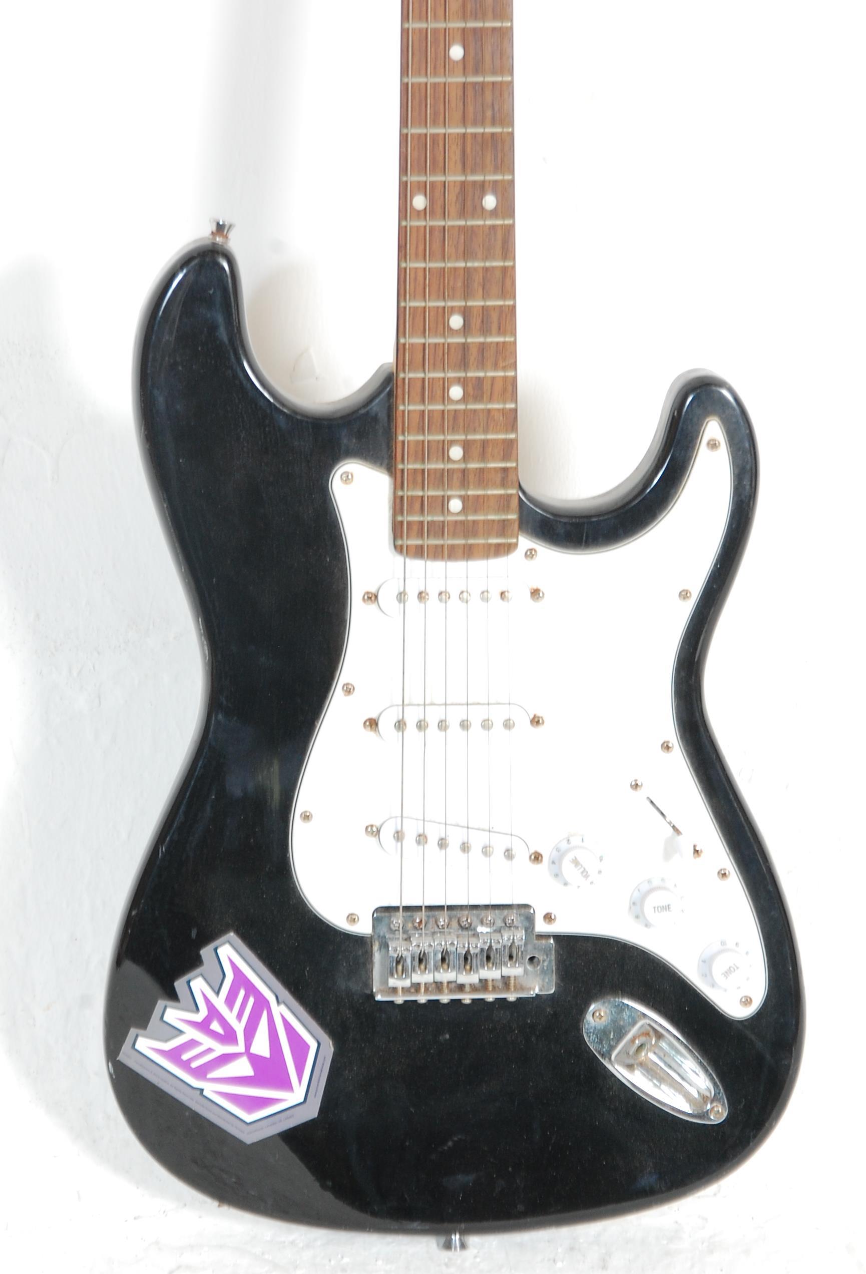 A six string electric guitar by Power Play having a black body with a white scratch guard, fretboard - Image 2 of 7