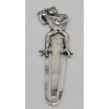 A stamped 925 novelty silver bookmark having a finial top in the form of a frog playing a lute.