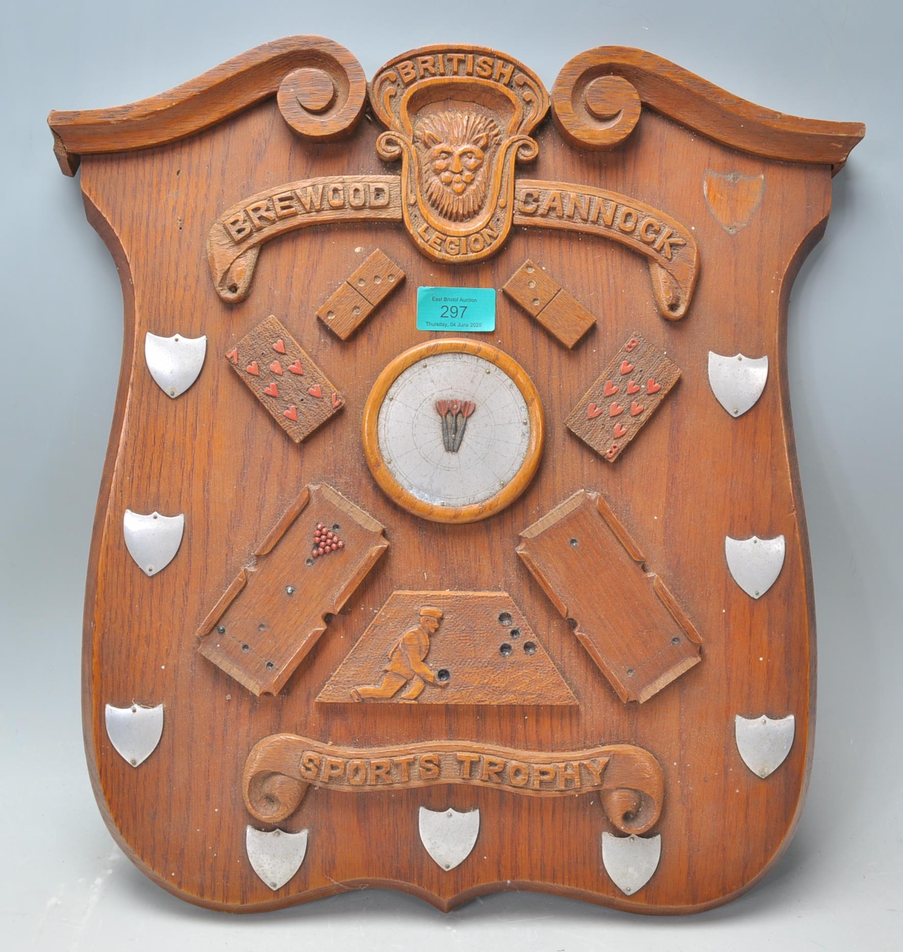 A vintage wooden wall  plaque British Brewood Cannock Sports Trophy of armorial shield form having