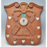 A vintage wooden wall  plaque British Brewood Cannock Sports Trophy of armorial shield form having