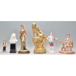 A group of 20th Century ceramic figurines to include a a Spode hand painted gentleman figurine, a
