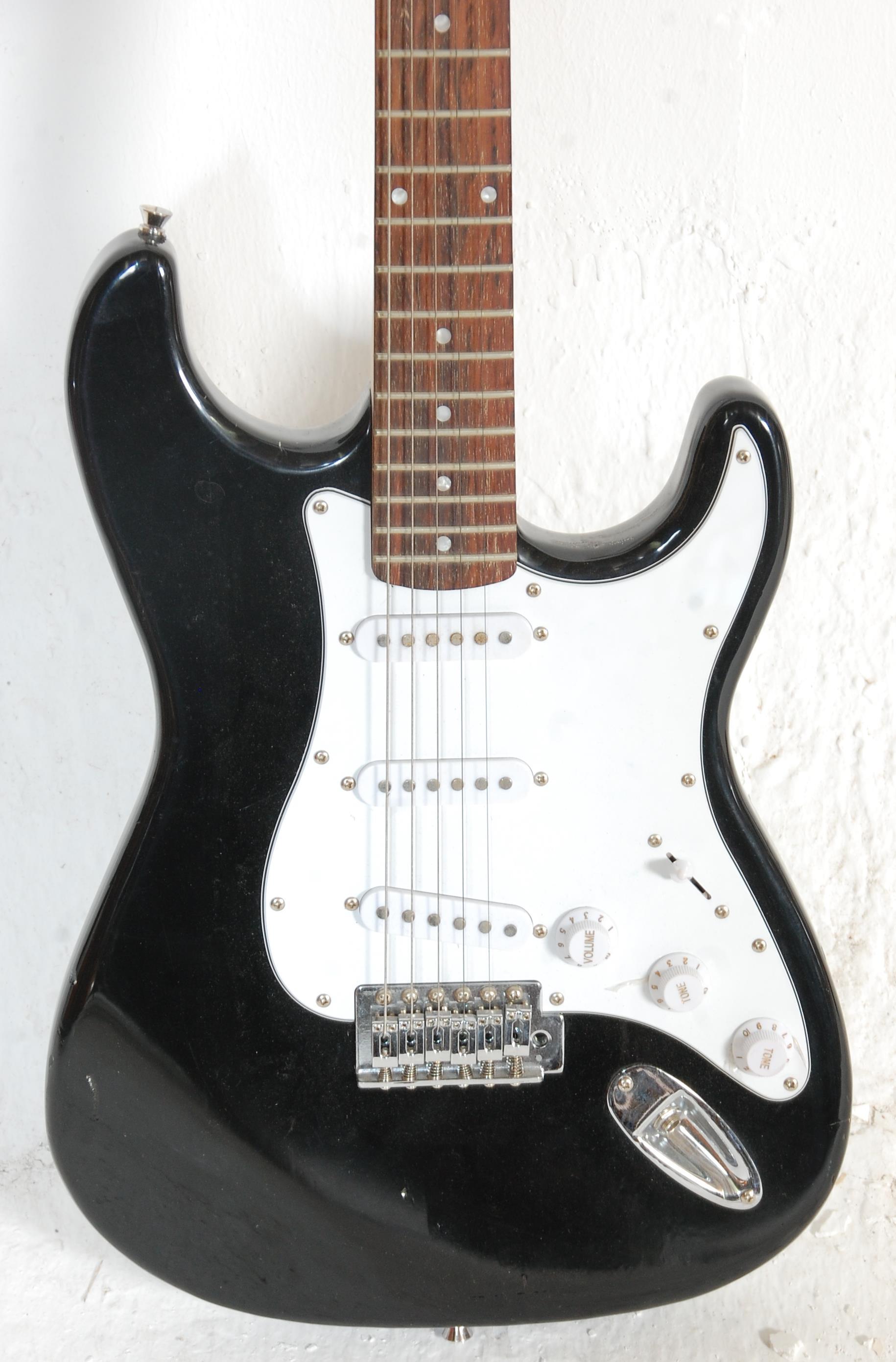 A good Fender style six string electric guitar by Groove having a white scratch guard and black body - Image 2 of 6