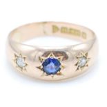 An Edwardian hallmarked 15ct gold sapphire and diamond domed gypsy ring. The ring having a central