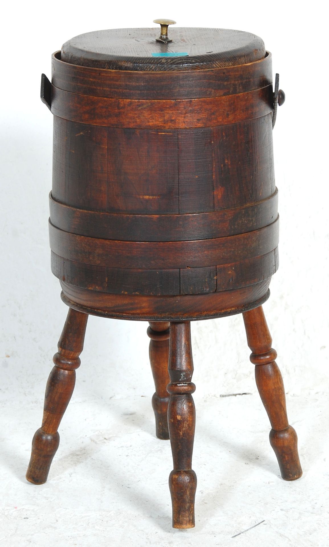 A 20th Century stained pine coopered wine cooler barrel / planter raised on turned supports with a