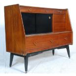 A vintage retro mid 20th Century G-Plan teak wood highboard / sideboard credenza  being raised on