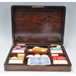A 19th century rosewood and brass inlaid games compendium / mah jong games box having brass line