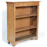 A late Victorian 19th century Arts & Crafts solid light oak open window bookcase cabinet. Having a