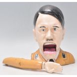 A 20th century cast iron nutcracker, in the form of Adolf Hitler. Hand painted, with moving arm