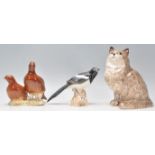 A collection of 20th century animal figurines to include a Beswick 2063 group of partridges together