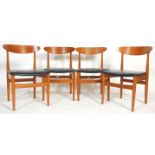 A good set of four 20th Century Danish inspired retro vintage teak wood dining chairs having