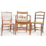 A set of 3 chairs to include an Edwardian mahogany inlaid bedroom chair with spindle gallery