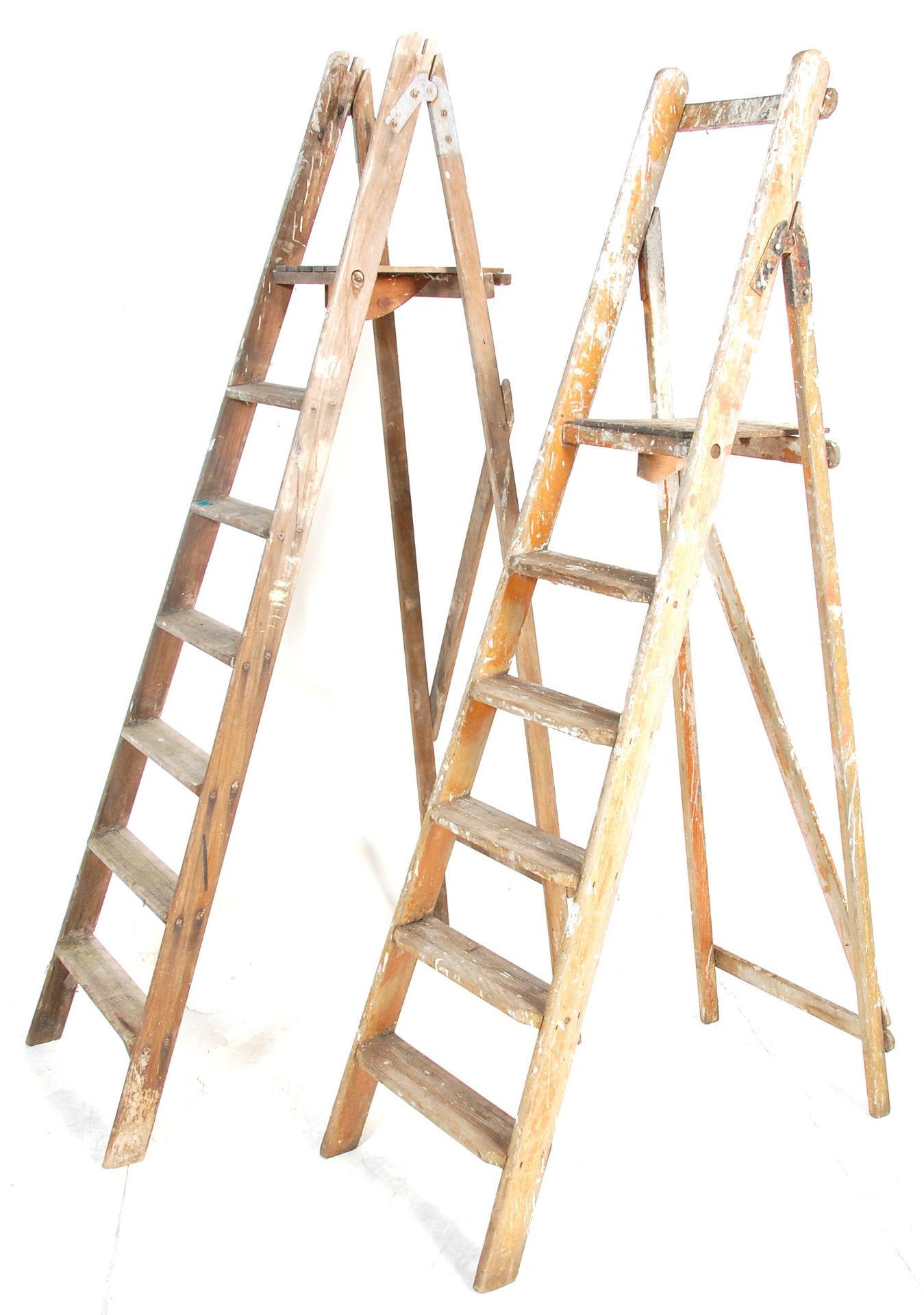A pair of vintage ladders with one set having graduating steeps and the other straight. 185cm x
