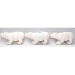 A group of three 20th Century garden wall mounting plaques in the form of hippos.