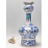 An 18th Century Delft Chinese style guglet / tulip vase converted into a lamp, being hand painted in