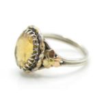 A good vintage silver ladies ring set with a faceted cut large citrine stone with 9ct gold flower