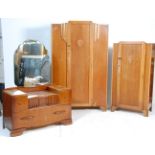 An early 20th Century Art Deco oak bedroom suite consisting of a single wardrobe, bachelors wardrobe