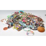 A large collection of vintage costume jewellery to include a good selection of beaded necklaces,