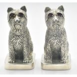 A pair of stamped 800 silver salt and pepper condiments in the form of terrier dogs, each being