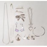 A mix of silver jewellery to include a decorative flower brooch, Copenhagen, wave bangle, multiple