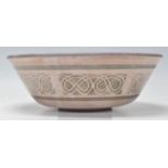 A retro 20th Century studio art pottery bowl having a flared rim with geometric pattern decoration