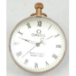 A brass and glass ball / orb clock having a white enamelled face with roman numerals to the