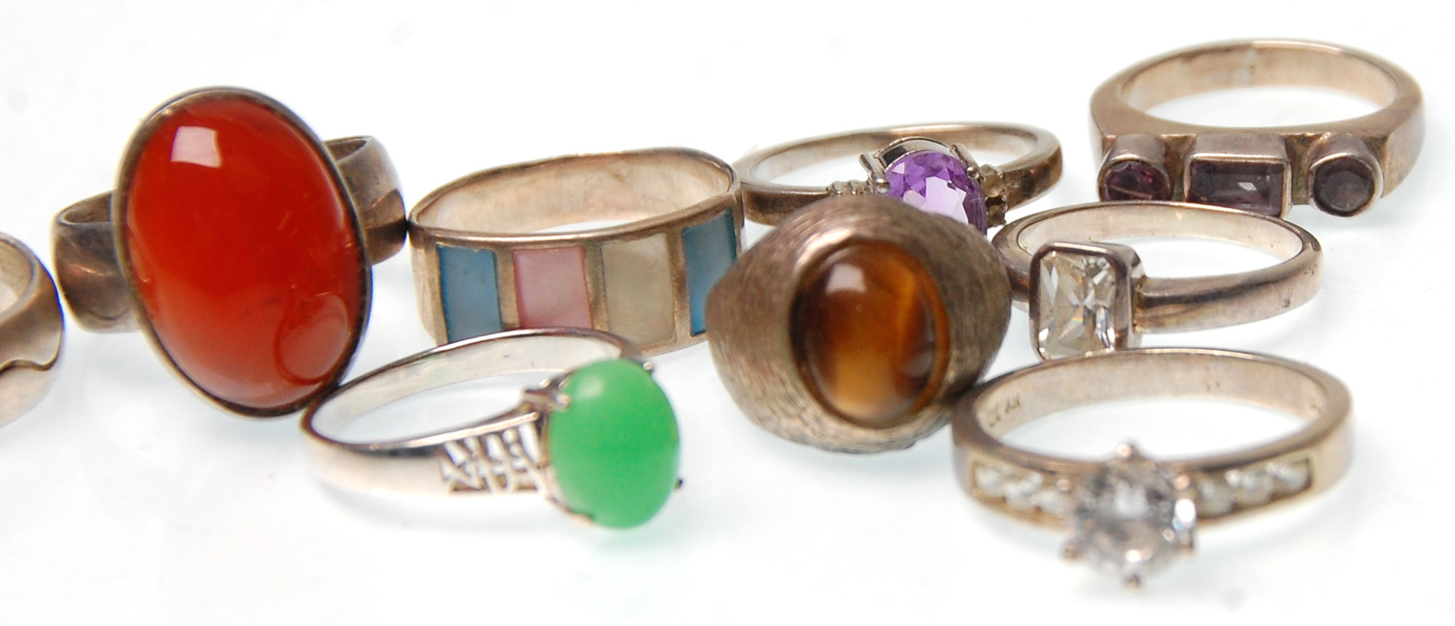 A collection of fifteen vintage silver rings to include two rings set with tigers eye, a redstone - Image 4 of 4