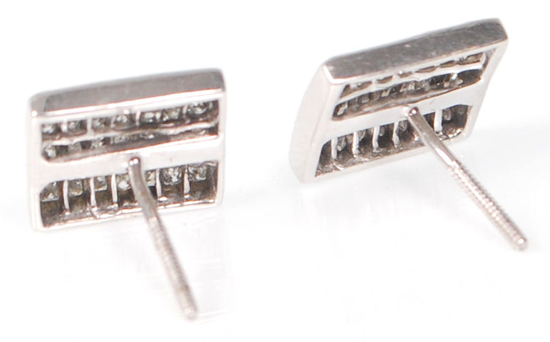 A pair of 14ct white gold ladies earrings having square heads set with a cluster of square cut - Image 3 of 5