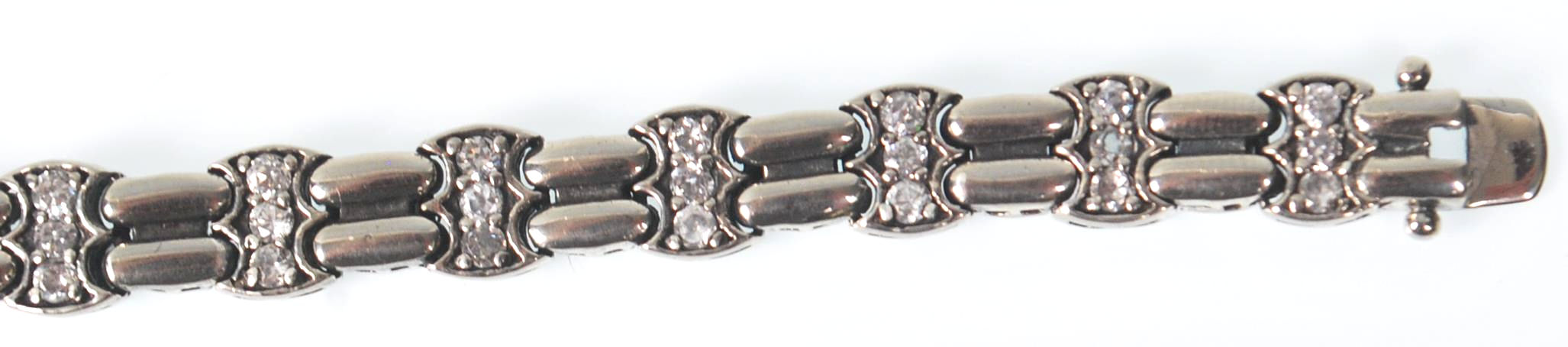 A ladies stamped 925 silver line bracelet being set with three round cut CZ stones with a tongue - Image 4 of 7