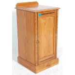 A late 19th century pitch pine Arts & Crafts bedside table cupboard / cabinet having a chamfered top