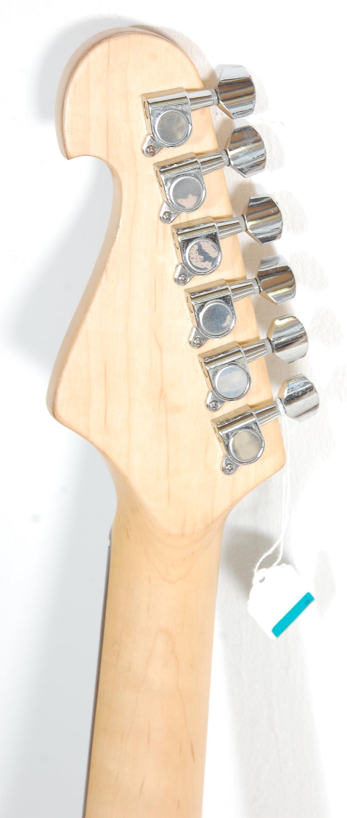 A good Fender style six string electric guitar by Groove having a white scratch guard and black body - Image 5 of 6