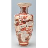 A late 19th / early 20th Century Japanese vase hand decorated in red and white with male figures
