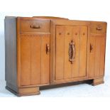 A good early 20th Century Art Deco oak sideboard / dresser having a single central cupboard