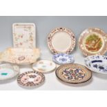 A mixed group of English china cabinet plates and dishes to include a gilt ribbon plates, Clarice