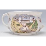 A 19th Century Victorian humorous pottery chamber pot. The interior decorated with two figures in