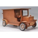 A wooden built model of a vintage car / van.  51cm long.