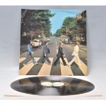 A vinyl long play LP record album by The Beatles – Abbey Road – Original Apple Records 1st U.K.