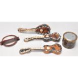 A group of antique tortoise shell ornaments to include two miniature guitars and a lute, each