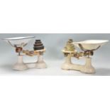 Two pairs of vintage F.J. Thornton kitchen scales with both having a cream finished base and
