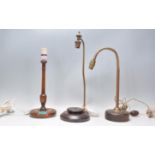 A good group of three vintage 20th Century two brass and mahogany based table lamps with a reeded