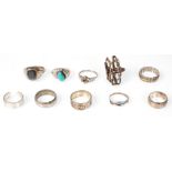 A group of ten silver and white metal rings to include a 925 silver mexican blue and black enamel