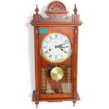 A contemporary mahogany cased regulator wall clock by Highlands having a single glazed door