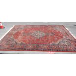 A good vintage 20th Century large Persian / Islamic floor rug carpet having red ground with blue