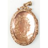 A Victorian 9ct gold back and front ladies oval shaped locket having finely engraved floral and