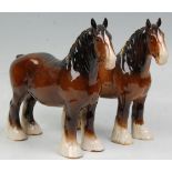 A  collection of 2 Beswick horse porcelain figurines to include 2 bay coloured shire horses all