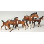 A  collection of  Beswick horse porcelain figurines to include dark brown bay coloured horses,