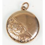 An unusual 9ct gold front and back ladies pendant locket having finley engraved floral and scroll
