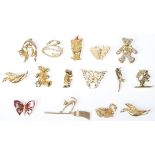 A collection of fifteen vintage yellow metal brooches to include teddy bear brooches, animal and